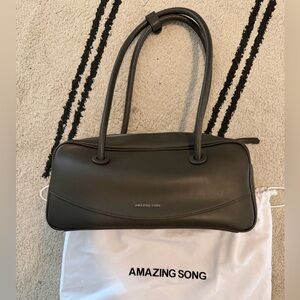 Amazing Song Smiley Face Pillow Bag in a dark green